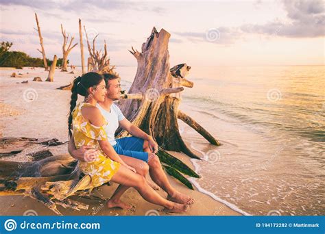 Beautiful Sunset Honeymoon Vacation Couple Relaxing On Summer Holiday Watching Sunset At Florida