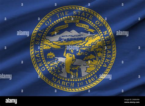 Nebraska Us State Flag With Big Folds Waving Close Up Under The Studio