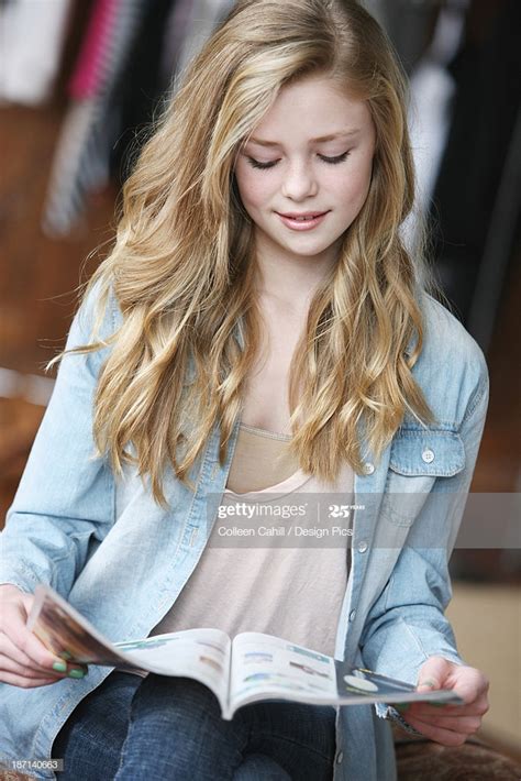 This particular look is best for young girls as it doesn't want blonde layers are one of the easiest styles for teenage girls with long curly hair. Teenage Girl With Long Blond Hair And Blue Eyes Reading A ...