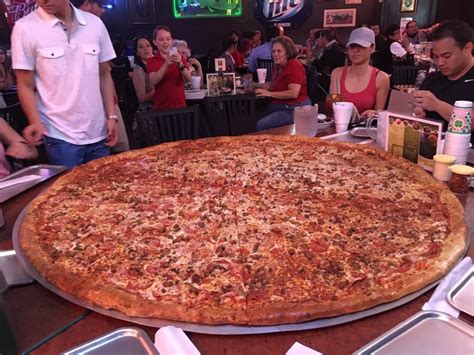 How much bigger is a 14 inch pizza than 12? #3 62-Inch Pizza, Big Lou's, San Antonio from America's ...