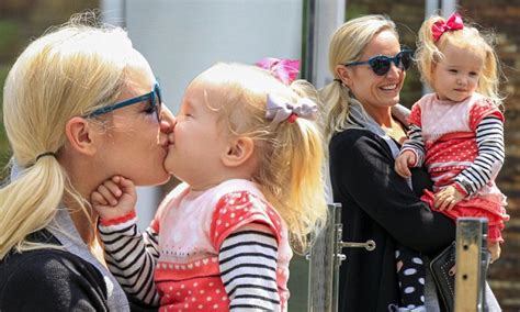 Fifi Box Dotes Upon Daughter Trixie Belle As They Stroll Through