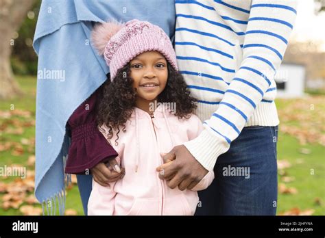Image Of Happy African American Parents And Daughter Posing At Camera