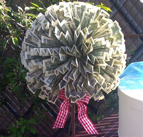I found this tree at the dollar store (so even if she throws it away after she takes the money off, it was only a dollar! Creative Cash Gifts for Grads (With images) | Cash gift, Creative money gifts, Money lei diy