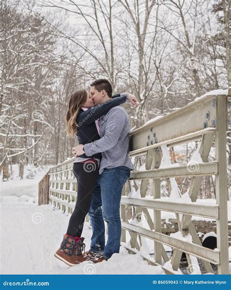 Young Couple Kissing Outdoors In Winter Stock Image Image Of