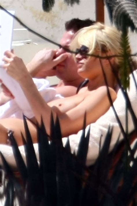 Paris Hilton Showing Her Tits On Vacation On While Sunbathing Paparazzi