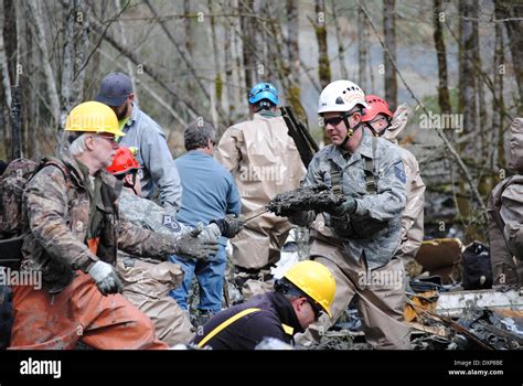 Rescue Workers Continue Efforts To Locate Victims Of A Massive Landslide That Killed At Least 28