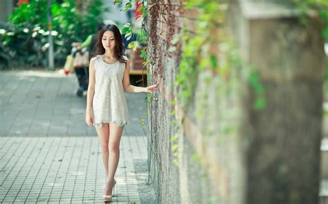 Download Korean Girl Walking Down The Street Wallpaper