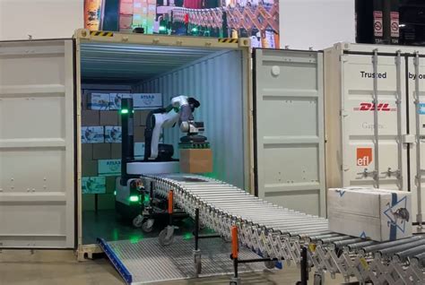 a look at automated trailer unloading systems the new warehouse