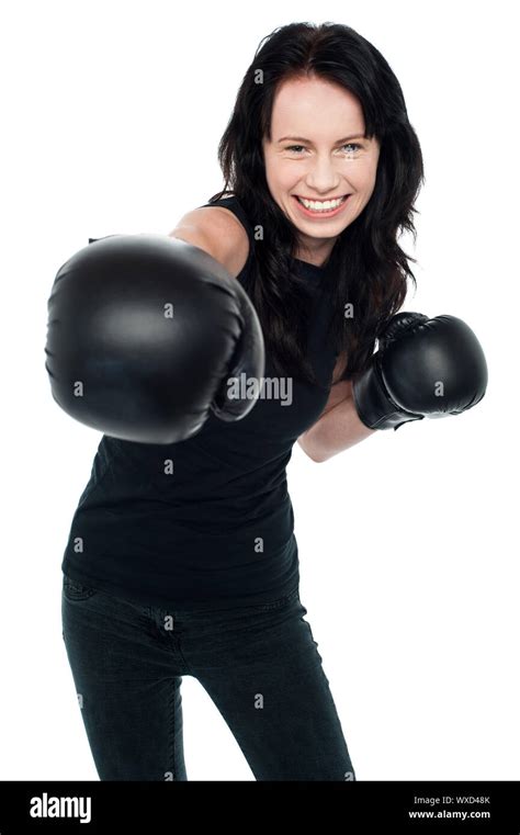Cheerful Young Female Boxer Is Ready To Throw A Punch Isolated On