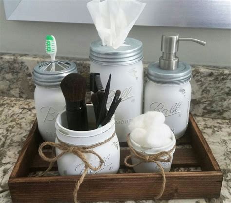 A diy tutorial on how to make your own mason jar bathroom storage, accessory set.includes how to paint and distress as well as sources for soap container lid. Farmhouse Bathroom Decor, Rustic Bathroom Decor, Mason Jar Bathroom Set, Southern Bathroom Decor ...