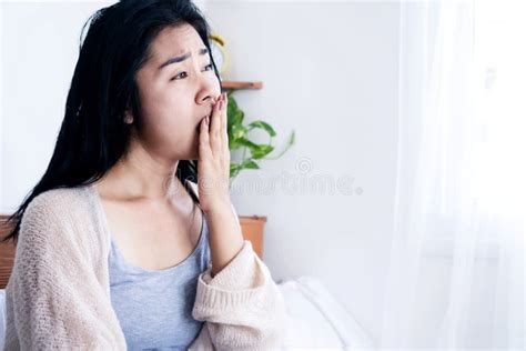Tired Asian Woman Yawning After Wake Up In Bed Feeling Sleepy In The
