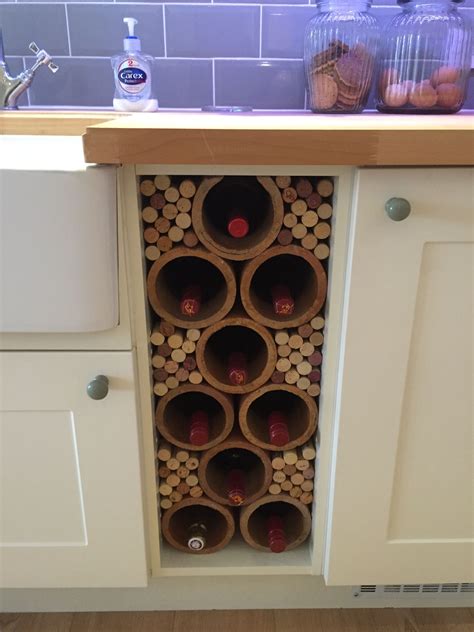 A Wine Rack Made From Reclaimed Clay Pipes And Used Corks Looks Great