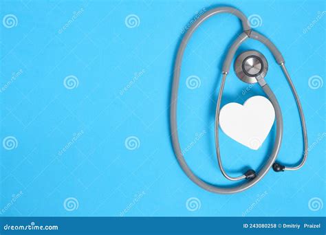 White Heart And Stethoscope On Blue Backgroundheart Disease Medical