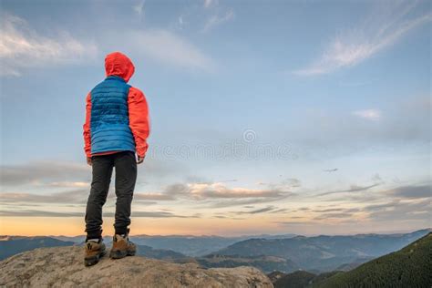 Young Child Boy Hiker Standing In Mountains Enjoying View Of Amazing