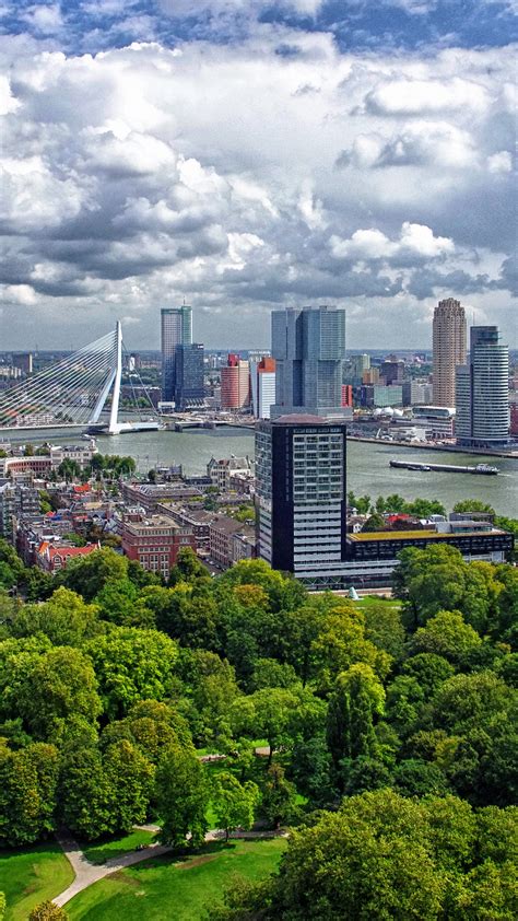 Aerial View Of Netherlands Harbor Rotterdam Under White Clouds Blue Sky