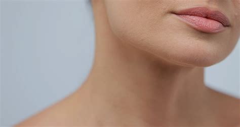 Close Up Beauty Portrait Of Young Woman Softly Touches Her Chin With A
