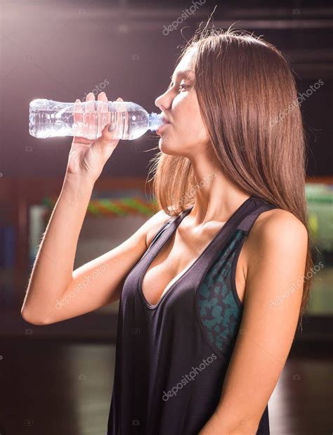Fitness Woman Drinking Water From Bottle Muscular Young