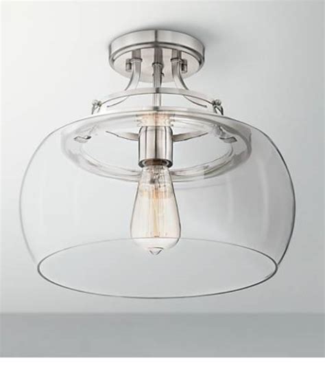 A Glass Light Fixture Hanging From The Ceiling