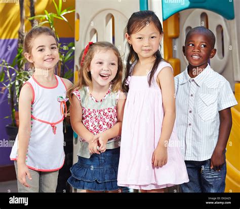 Happy Interracial Children Together In A Kids Group In A Kindergarten