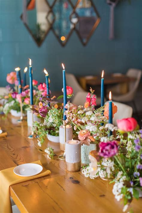 Long Table With Blue Taper Candles And Flowers In Bud Vases Wedding