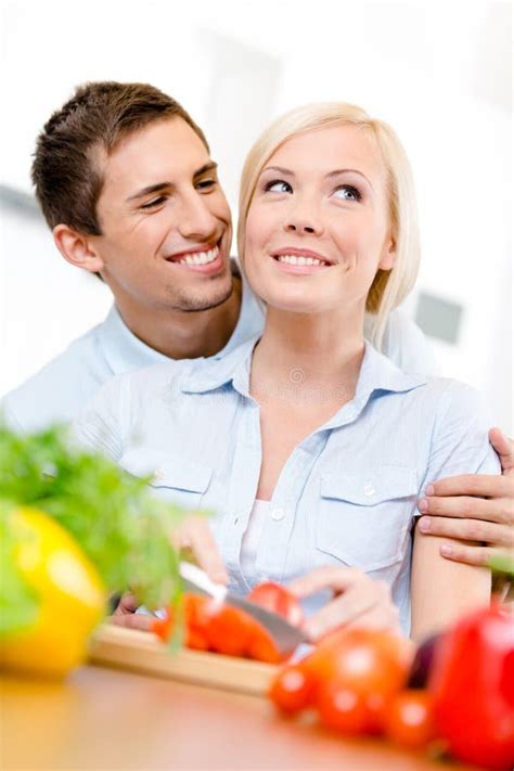 Man Embraces Girl Cooking Stock Photos Free And Royalty Free Stock