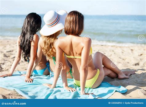 Girls Sunbathing On The Beach Stock Photography Image