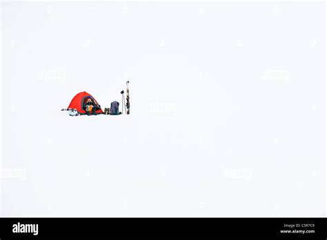 A Skier Camping In Deep Snow Stock Photo Alamy