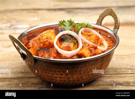 Indian Food Or Indian Curry In A Copper Brass Serving Bowl Stock Photo