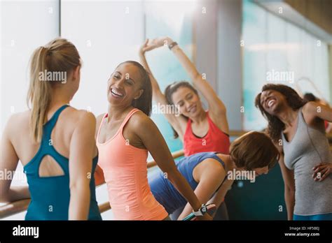 Smiling Women Talking And Stretching In Exercise Class Gym Studio Stock Photo Alamy