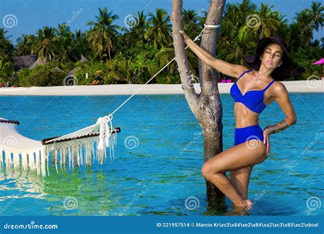 tanned woman bikini model at maldives tropical sand beach beautiful girl in swimsuit on hammock