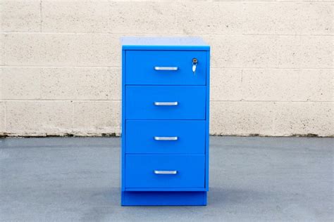 The metal shelves are prepared to support the hanging of folders. Vintage Steelcase File Cabinet, Refinished in Blue at 1stdibs