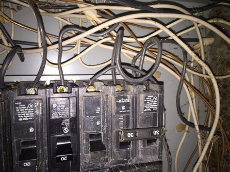 What is a 2 pole circuit breaker? Does this look okay? There's a wire jumped between the two ...