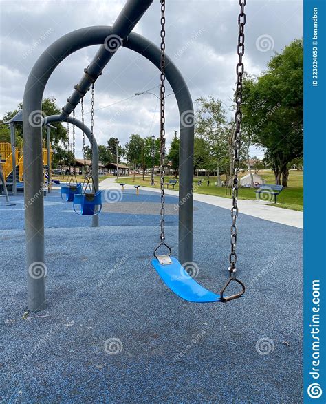 Swings At Children Playground Activities In Public Park Stock Photo
