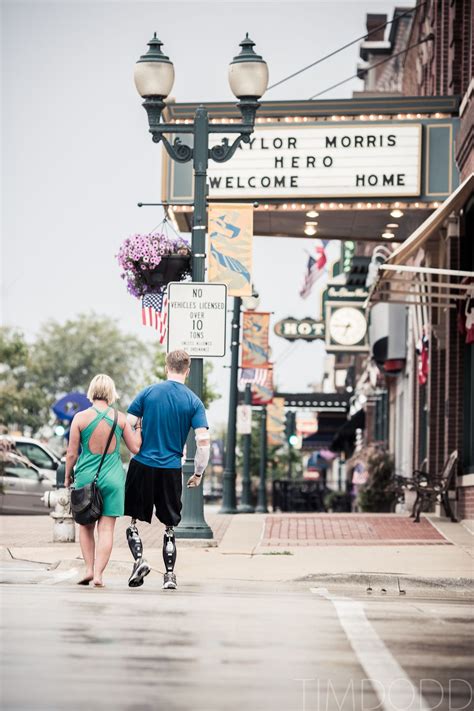 taylor morris and danielle kelly walk downtown cedar falls iowa which is decorated in