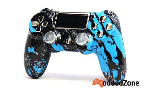 A Blue And Black Controller On A White Background