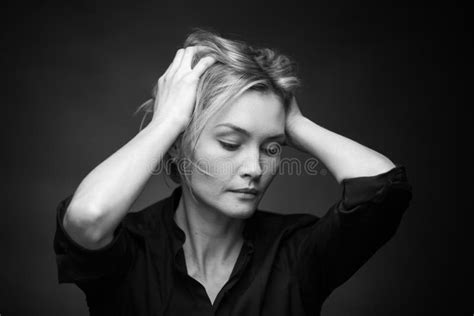 Dramatic Black And White Portrait Of A Beautiful Woman On A Dark