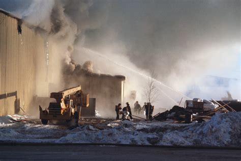 Firefighters battle a blaze caused by a propane leak at the Adak