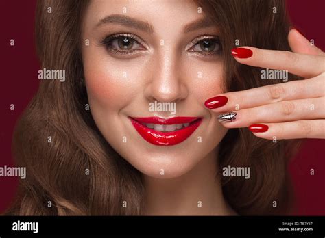 Beautiful Girl With A Classic Make Up Curls Hair And Multi Colored Nails Manicure Design