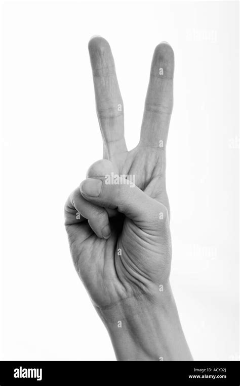 Woman Giving Peace Sign Victory Sign Black And White Image Stock Photo