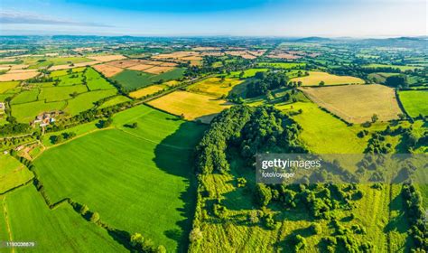 Aerial Panorama Over Green Summer Pasture Farm Fields Crops Villages