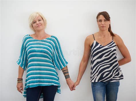Always Hand In Hand Portrait Of A Lesbian Couple Standing Hand In Hand Stock Image Image Of