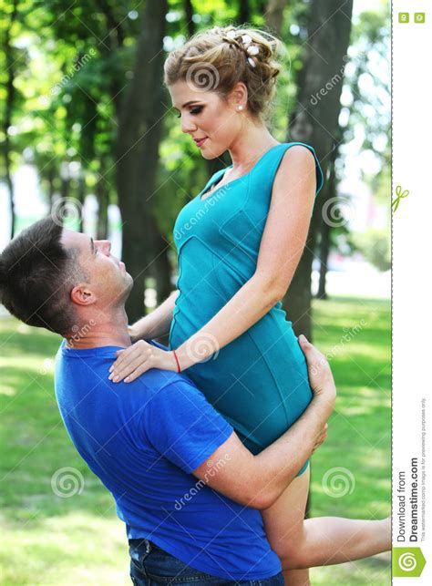 In Love Guy Holding Girl In His Arms Stock Photo Image