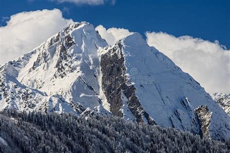 Beautiful Dramatic Snowy Caucasus Mountain Peaks And Blue Sky With