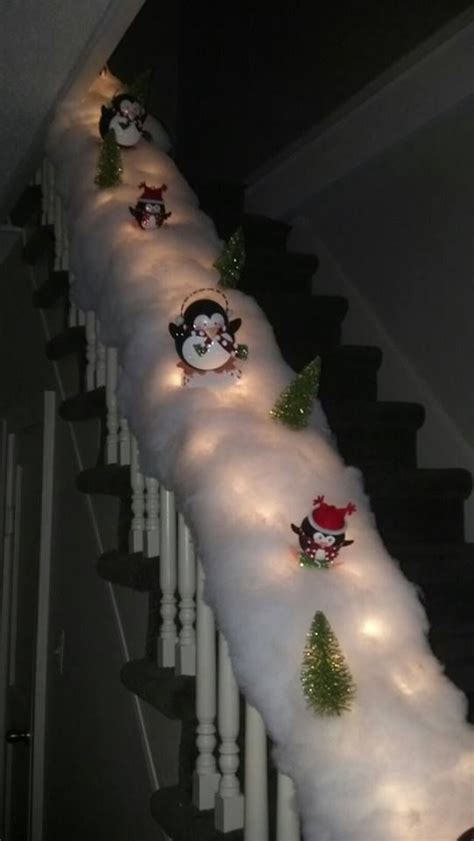 A Long Row Of Snowman Lights On The Side Of A Stair Case With Christmas