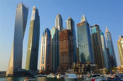 Panoramic View With Modern Skyscrapers And Water Pier Of Dubai Marina