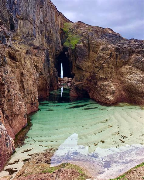discover this secret location in cornwall and explore the beautiful caves and waterfalls a must