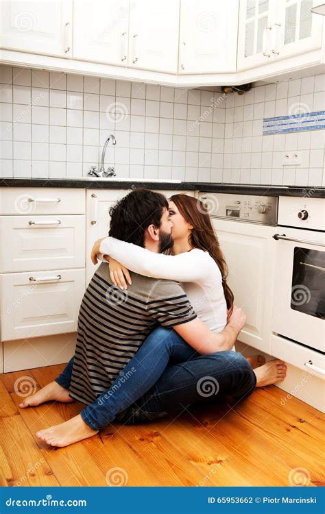 Romantic Couple Kissing In The Kitchen Stock Photo Image 65953662