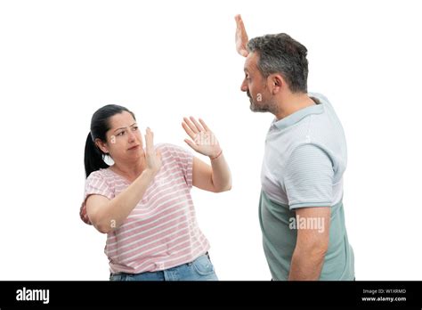 Angry Man Getting Ready To Hit Woman With Palm Up As Domestic Violence