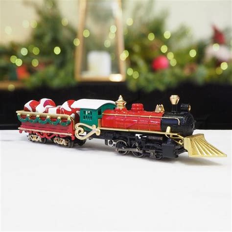 A Toy Train With Santa S Sleigh On It