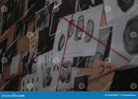 Detective Board With Fingerprints Photos Map And Clues Connected By